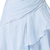 Close-up of a light blue draped skirt with layered ruffles and a gathered waist, shown against a plain white background.