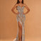 A woman models a strapless floor-length evening gown with a sweetheart neckline, high thigh slit, and dramatic cascading sequin detailing in gold, silver, and light blue on a warm beige background.