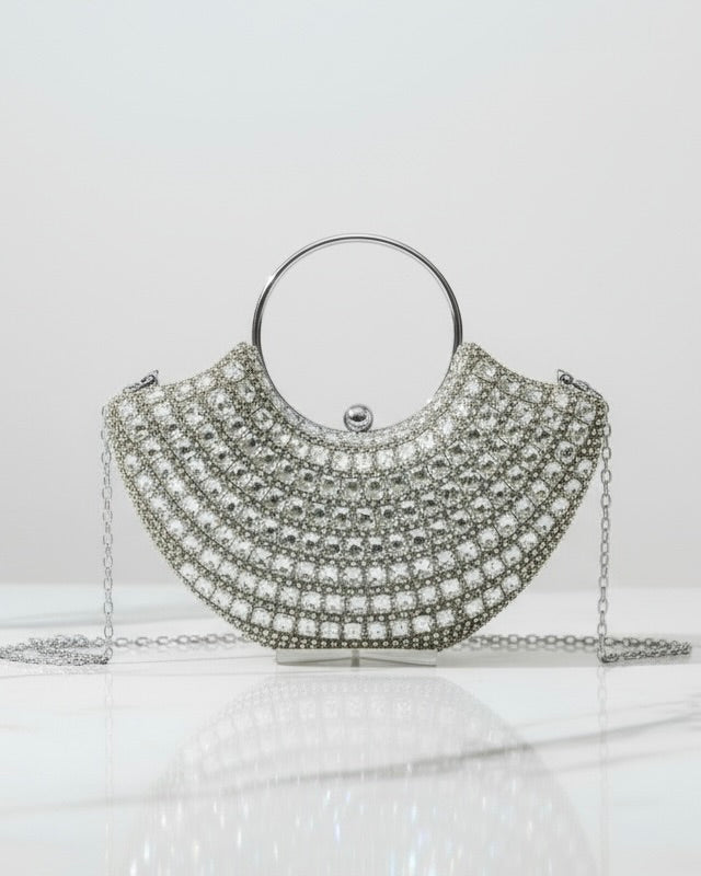 Silver handbag with chain strap on a white background