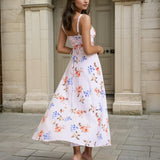 Woman wearing a midi floral dress back view