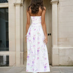 Woman wearing a strapless floral dress 