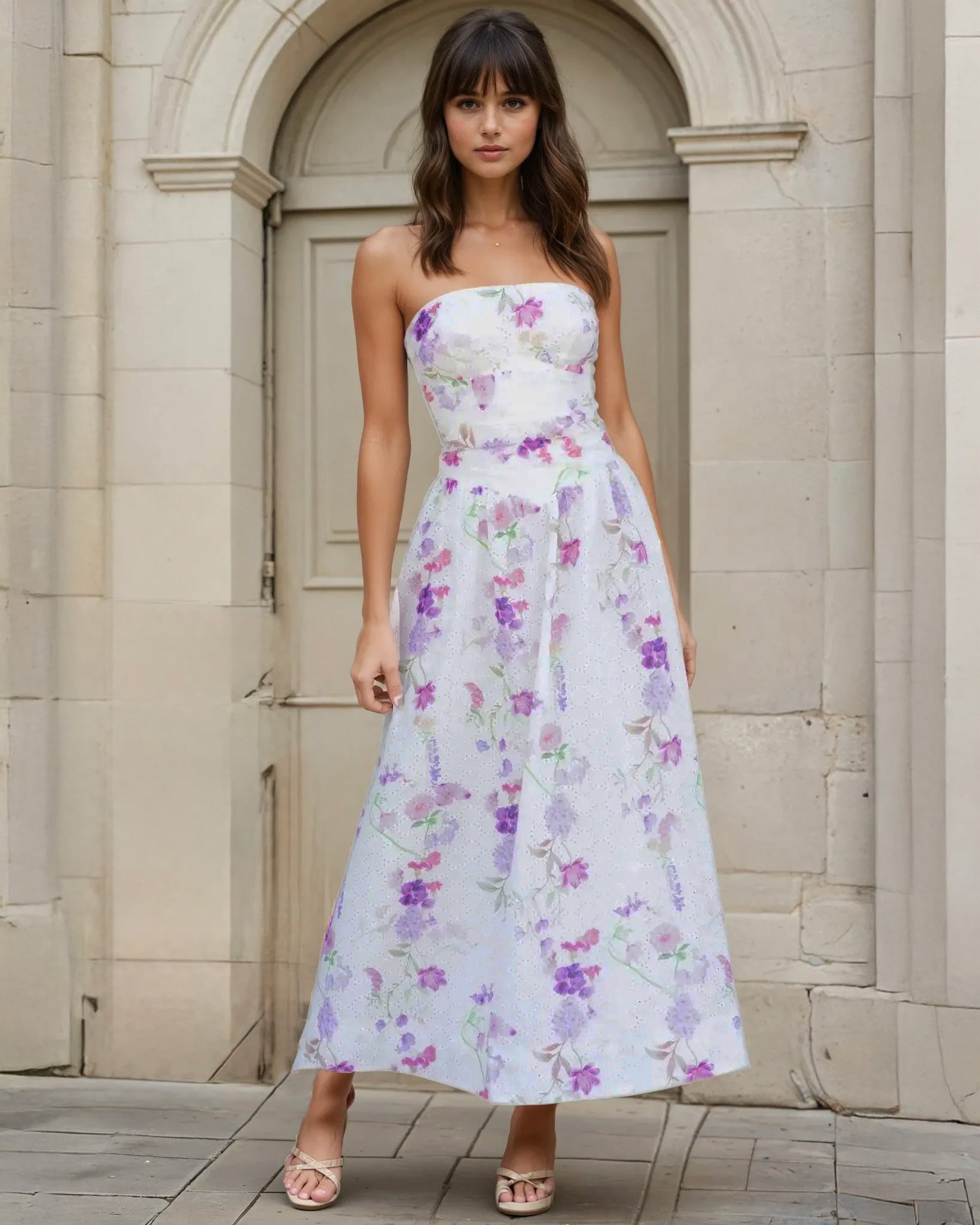 Woman wearing a strapless broderie white floral dress 